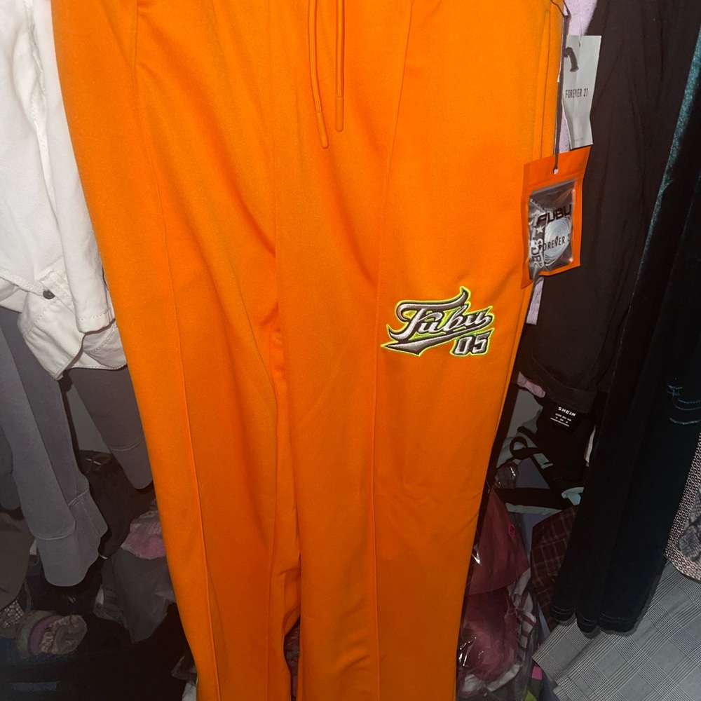 matching orange sweat pants and bucket hat